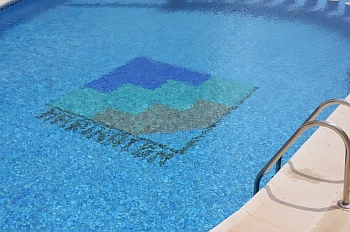 Enjoy a dip in the cool clear water of the swimming pool